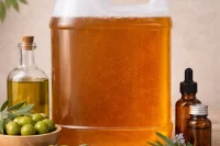 Castile liquid soap base by Natural Choice Cosmetics in a jerry can with olives