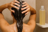 Lady washing her hair with Natural Shampoo Base