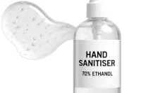 Bottle of hand sanitiser and puddle of it to the side