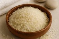 Timber bowl of Luxurious Bath Salts in a spa setting